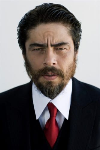 Benicio del Toro Slicked Back Hair with a slightly unkept beard.