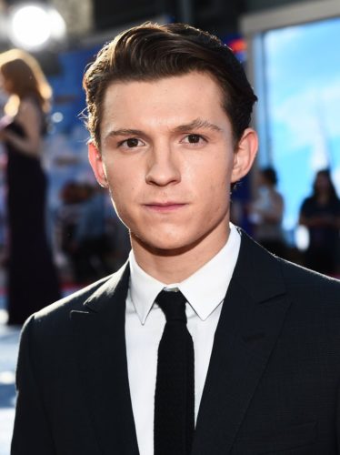 Tom Holland with a clean cut hairstyle.