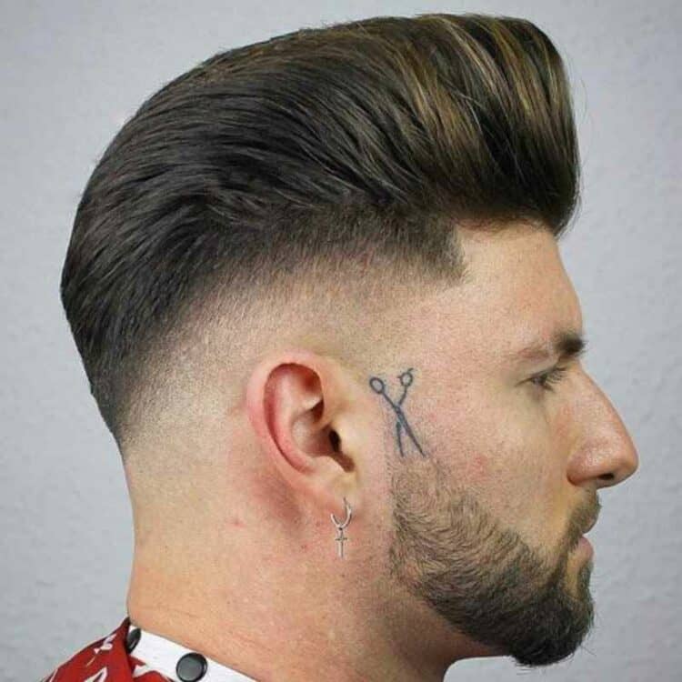 brushed back pompadour fade with beard