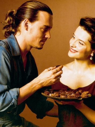 Johnny Depp's long hair is pulled back in a ponytail for the movie Chocolat.