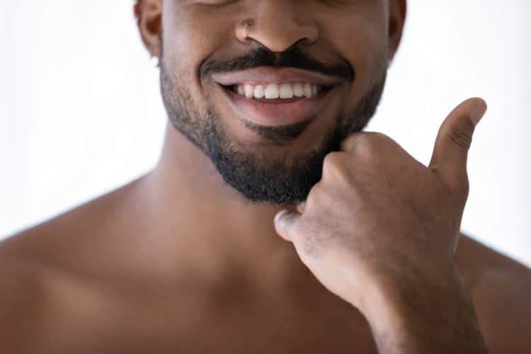 Learn how to use beard balm and tame unruly facial hair.