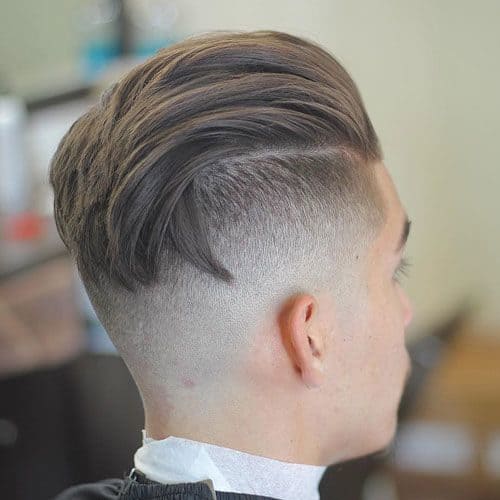 Longer style hair sporting a Comb Over Undercut.
