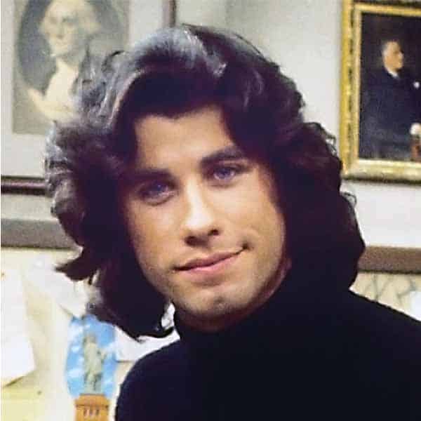 Young John Travolta with long hair