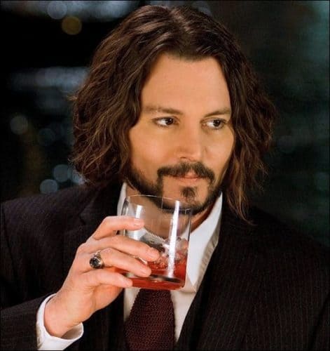 Johnny Depp shoulder length hair and beard.