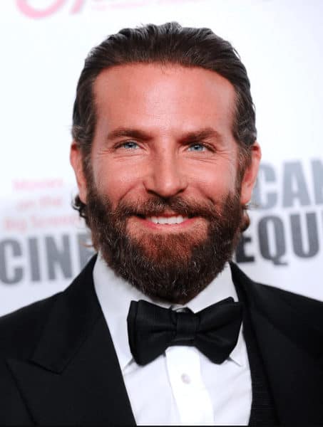 Bradley Cooper with slicked back hair and long beard