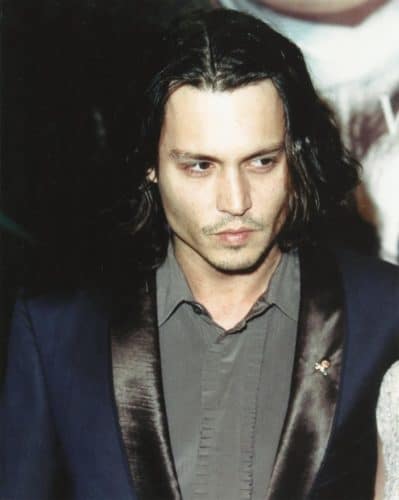 Johnny Depp long hair with a central part.