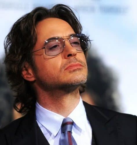 RDJ with long hairstyle and middle part.