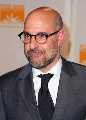 Stanley Tucci with Round Mid-century Two-tone Glasses. Classic bald style.