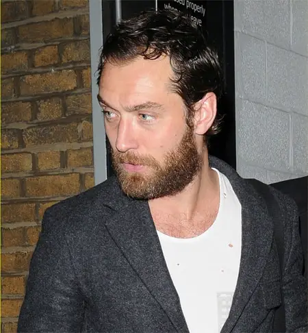 Jude Law Sideburns, short beard and full hairline.